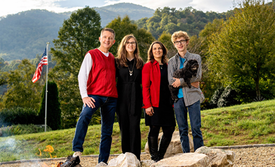 Family of four with a dog